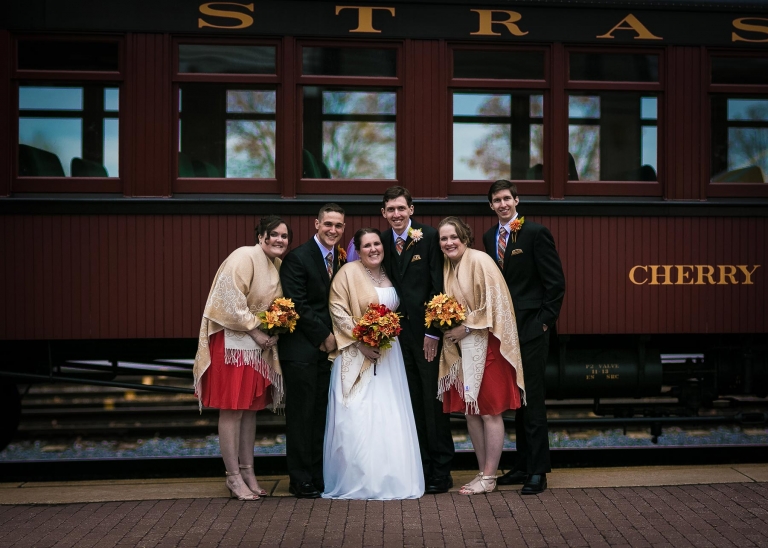 Wedding party in front of train
