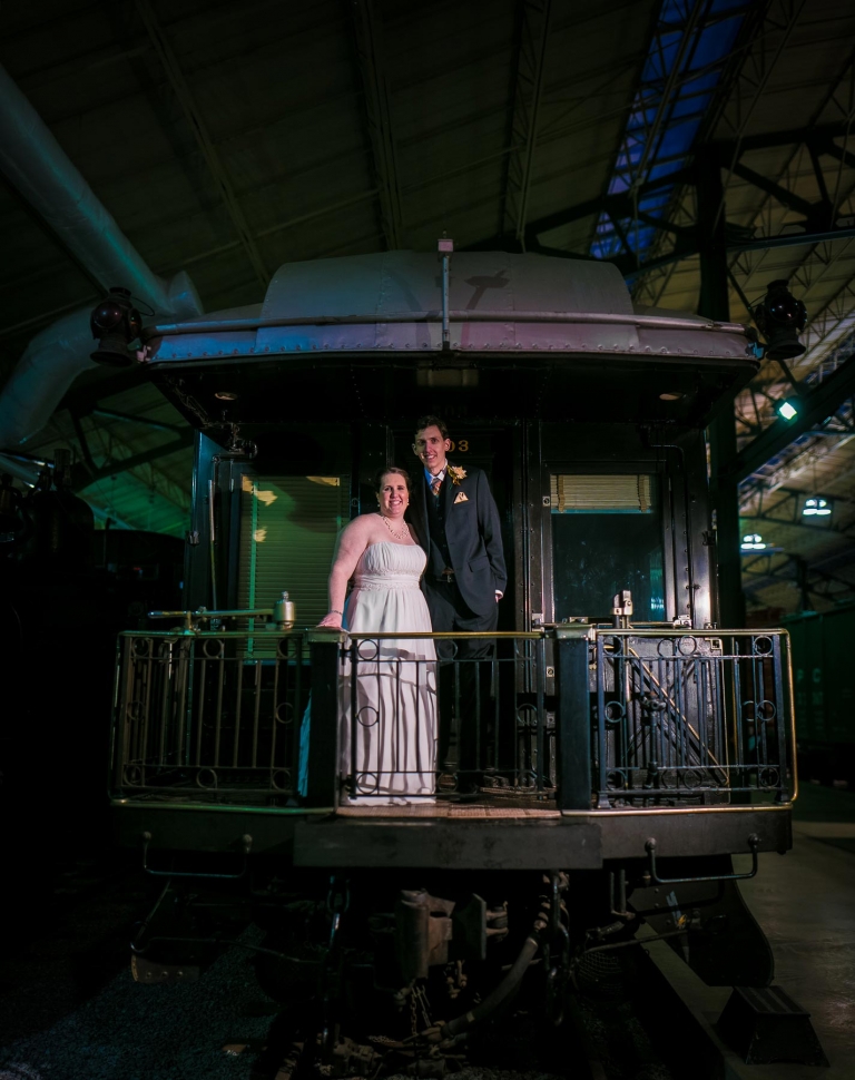 Bride and groom on caboose