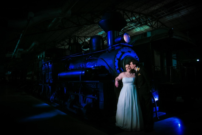 Modern wedding photo in front of train
