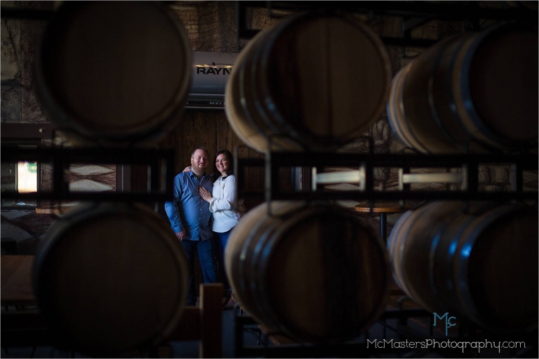 Engagement photo Bluebird Distilling whiskey barrels