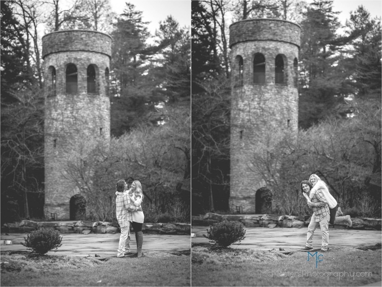 Engagement photo of couple kissing in front of chime tower at longwood gardens