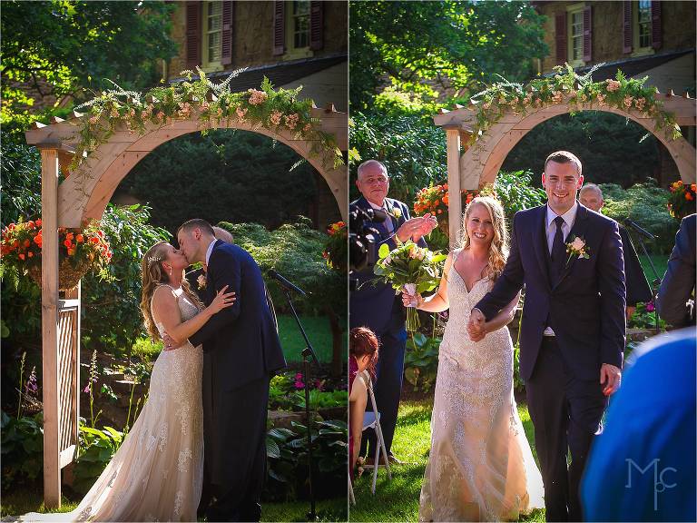 Joseph Ambler Inn wedding ceremony outdoor bride and groom kiss