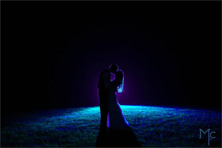 Joseph Ambler Inn Wedding bride and groom night photo in grass backlit with gel flash
